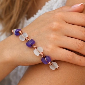 Use diamond drill bits and your Dremel tool to to drill sea glass and sea shells.  a copper and drilled sea glass bracelet.