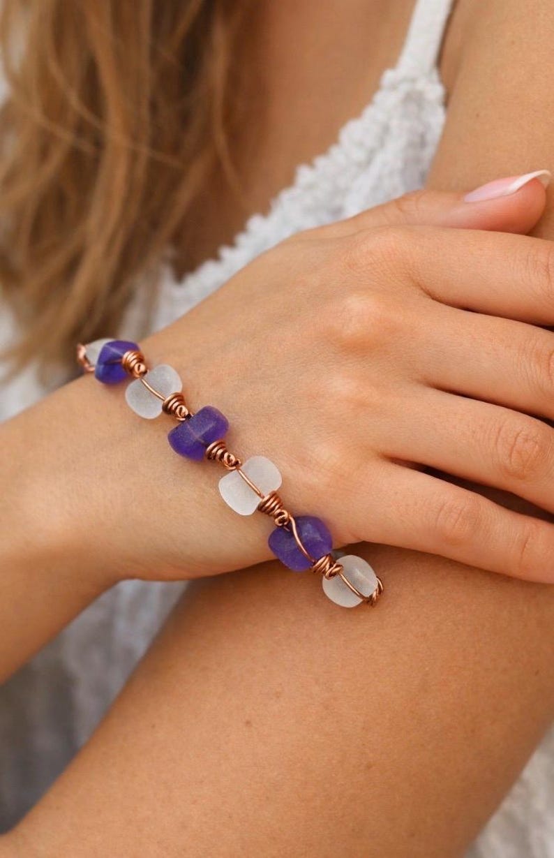 Use diamond drill bits and your Dremel tool to to drill sea glass and sea shells.  a copper and drilled sea glass bracelet.