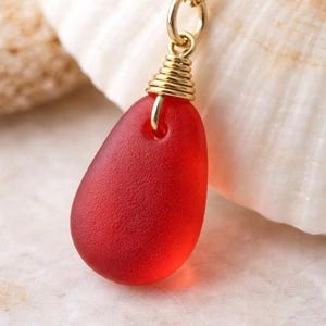 Use diamond drill bits and your Dremel tool to make drilled sea glass jewelry like this Red Sea glass necklace pendant.