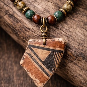 Use diamond drill bits and your Dremel tool to drill pottery shards and make jewelry