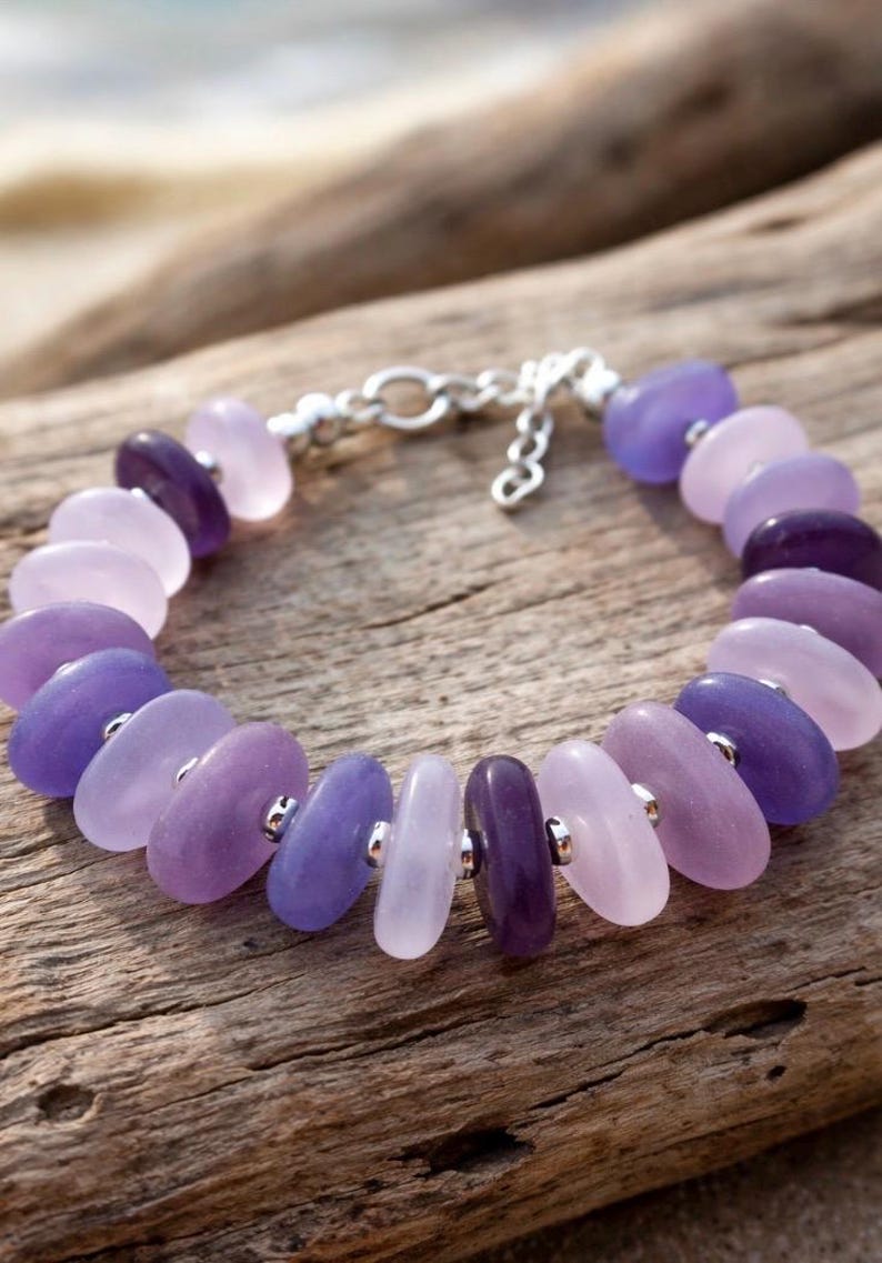 Made with a diamond glass drill bit and your Dremel tool.  a purple and white drill sea glass bracelet.