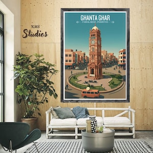 May include: A framed print of Ghanta Ghar, Faisalabad, Pakistan. The artwork shows a detailed clock tower in a city scene, with surrounding buildings and a blue sky. An orange bus is in the foreground.