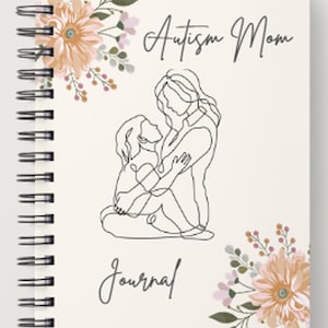 Op de afbeelding: Een spiraalgebonden notitieboek met een crèmekleurige kaft. De kaft toont de woorden "Autism Mom Journal" in script, een lijntekening van een moeder en kind, en bloemaccenten in perzik en groen.