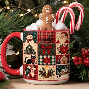 May include: A ceramic mug with a red handle and a grid pattern featuring Christmas icons including a snowman, reindeer, Santa Claus, a black cat, stockings, and a gingerbread man. The mug is filled with white marshmallows and two candy canes.