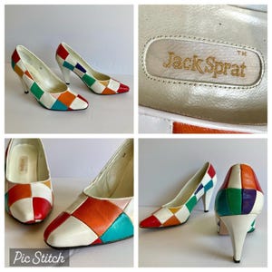 May include: A pair of vintage Jack Sprat heels. The shoes feature a patchwork design with red, orange, yellow, green, blue, and purple squares. The heels are white with a pointed toe and a heel height of approximately 3 inches.