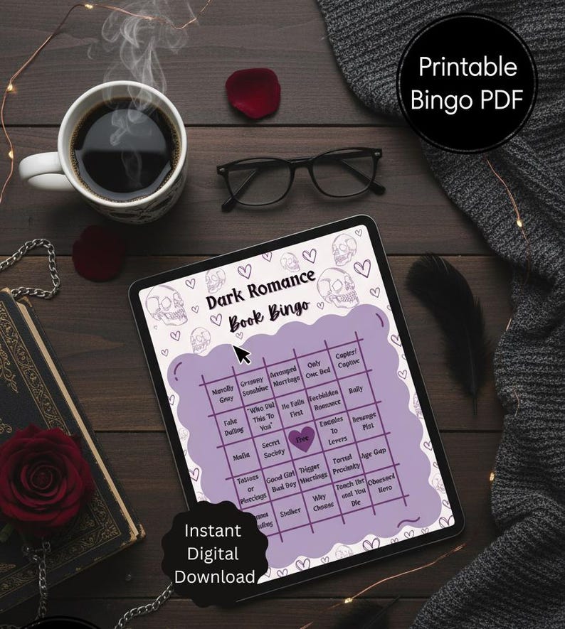 May include: A digital tablet shows a "Dark Romance Book Bingo" game with skull and heart illustrations. The image includes a coffee cup, glasses, a rose, and the text "Instant Digital Download."