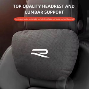 May include: A black headrest and lumbar support cushion with the text "TOP QUALITY HEADREST AND LUMBAR SUPPORT". The cushion is made of perforated suede and features a white logo. The text "Perforated suede, comfortable and soft, breathable anti-sweat and anti-bacterial" is also visible.