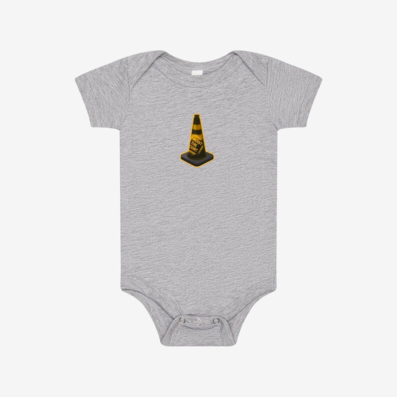 May include: A heather gray short-sleeve bodysuit featuring a centered graphic of a yellow and black traffic cone with the text HOIST THE CONE printed on the side. The garment has a round neckline and a snap closure at the bottom for easy access.