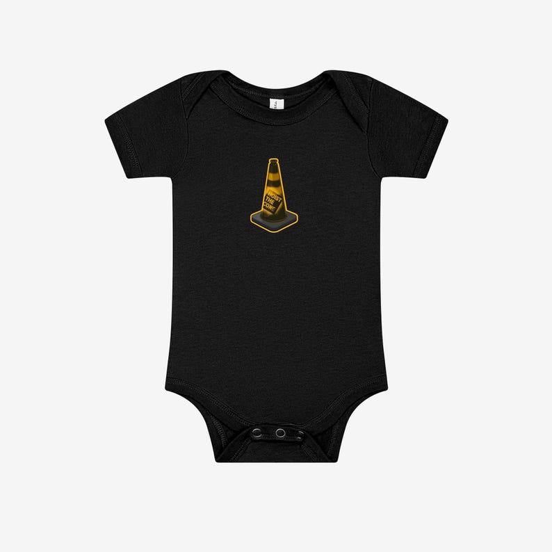 May include: A black short-sleeve baby bodysuit featuring a centered graphic of an orange and black traffic cone. The cone has the text HOIST THE CONE printed in black letters on its side. The garment has a round neckline and snap closures.