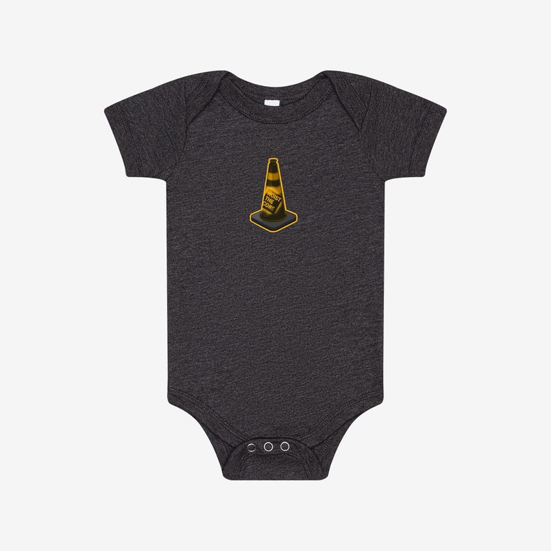 May include: A dark charcoal grey short-sleeve baby bodysuit featuring a centered graphic of a yellow and black traffic cone. The cone includes the text "HOIST THE CORE" printed in black lettering on its side, with a square base and short sleeves.