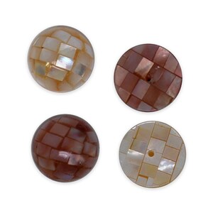 May include: Four circular buttons featuring a mosaic pattern of small, iridescent shell tiles. Two buttons are a light, pearlescent cream color, while the other two are a deep, reddish-brown hue. Each button has a smooth, rounded surface.