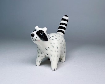 Ceramic raccoon ring holder totem