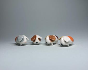 Tótem de cerámica con forma de conejillo de indias