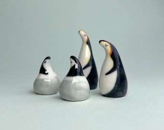 Ceramic mini parent & baby penguins