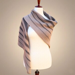 boho modern triangle shawl shown gracefully draped over one shoulder to highlight the clean lines of the design