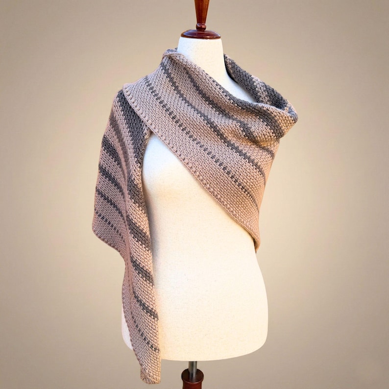 boho modern triangle shawl shown gracefully draped over one shoulder to highlight the clean lines of the design