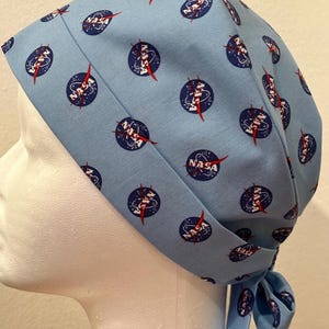 May include: A handmade wooden sign with the text "Welcome" in a playful font. The sign features a distressed white background and a dark stained wooden frame. Dimensions are approximately 12 inches wide and 6 inches high.