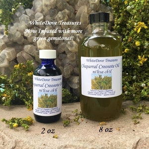 May include: Two bottles of Chaparral Creosote Oil, one 2 oz and one 8 oz, with a label that says "White Dove Treasures Chaparral Creosote Oil ni'ltsa ch'il" and "Infused Organic Chaparral organic virgin olive oil + vit E oil aventurine stone + quartz crystal".