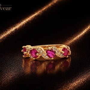 Anello eternity con rubino rosso ovale da 1,2 carati, placcato oro rosa, con fascia regolabile.