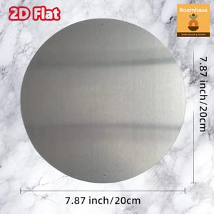 May include: A circular, flat, silver-colored metal disc, approximately 7.87 inches (20 cm) in diameter. The product is labeled "2D Flat" and includes the "Roomhaus HOME DECOR & DESIGN" logo.