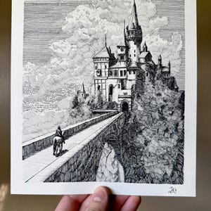 May include: A black and white ink drawing on paper depicting a large castle with multiple towers perched on a rocky cliff. A stone bridge leads to the castle entrance, with a lone figure riding a horse across the bridge. The sky features detailed clouds.