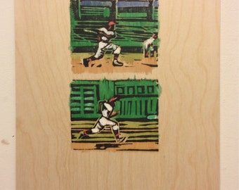 Print on wooden panel, 12x9in. Linocut with watercolor added. "Swing and Run."