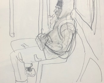 Sitting subway rider with hoodie and hands in pockets