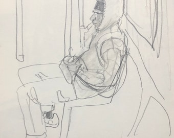 Sitting subway rider with hoodie and hands in pockets