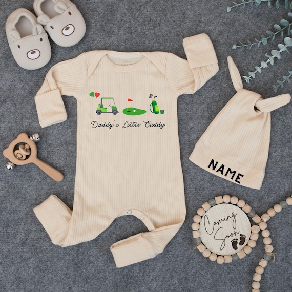→ View on Etsy: Daddy's Little Caddy Baby Bodysuit And Hat- Golf Baby Outfit, Daddy’s Golfing Buddy Bodysuit, Father's Day Baby Gift, Pregnancy Announcement Daddy's Little Caddy Baby Bodysuit And Hat- Golf Baby Outfit, Daddy’s Golfing Buddy Bodysuit, Father's Day Baby Gift, Pregnancy Announcement