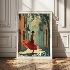 K&ouml;nnte beinhalten: Ein gerahmter Kunstdruck, der eine Person in einem flie&szlig;enden roten Kleid in einer engen Gasse zwischen hohen Geb&auml;uden zeigt. Die Szene enth&auml;lt warme Orange- und k&uuml;hle Blaut&ouml;ne, mit dem Wort SPAIN in wei&szlig;en Gro&szlig;buchstaben am unteren Rand.