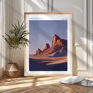 May include: A framed print featuring the Lut Desert in Iran. The image showcases a landscape of towering rock formations bathed in warm sunlight, with the text "Lut Desert" and "IRAN" displayed.