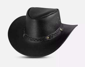 May include: A black leather cowboy hat with a wide brim and a braided band around the crown. The hat features decorative metal rivets and a structured design, suitable for outdoor wear.