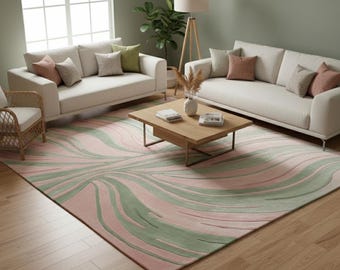 May include: A living room scene featuring a large pink and green patterned rug, two white sofas, and a wooden coffee table. The room is decorated with neutral-toned pillows, a floor lamp, and a wicker chair, creating a modern and inviting atmosphere.