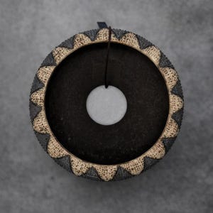 Handmade rough clay caudex planter with bold tooth-edge texture and natural kiln variations