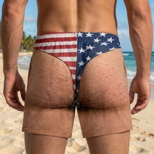 May include: Swim trunks featuring a split design with a red and white striped pattern on the left side and a blue field with white stars on the right side, mimicking the American flag, with a solid tan color on the lower leg sections.
