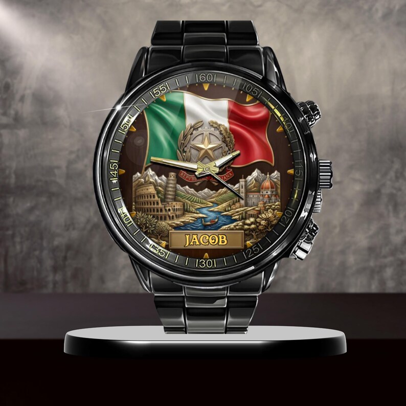 May include: Black wristwatch with an Italian flag design on the face. The watch face features the Italian flag, a star, and famous landmarks. The name "JACOB" is displayed on the watch face. The watch is displayed on a black stand.