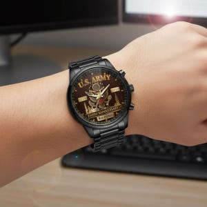 May include: Black wristwatch with a brown face featuring the text "U.S. ARMY" and "250TH ANNIVERSARY". The watch has a black metal band and a detailed design with the year 1775 and 2025. The name "RICHARD" is also visible.