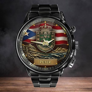 May include: A black stainless steel wristwatch featuring a round face with a Puerto Rican flag background, a central coat of arms with a lamb, and the name PETER printed on a gold-toned rectangular plaque. The watch has metallic hands and markers.