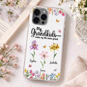 May include: A clear phone case with a floral design and the text "My grandkids make my life more grand." Features purple, pink, and yellow flowers with the names Sophia, Lucia, and Isabella. Butterflies and a dragonfly are also included.