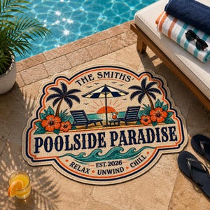 May include: A decorative round mat featuring a tropical beach scene with palm trees, lounge chairs, an umbrella, and hibiscus flowers. The text reads THE SMITHS, POOLSIDE PARADISE, EST. 2026, RELAX, UNWIND, and CHILL in a bold, colorful graphic design.