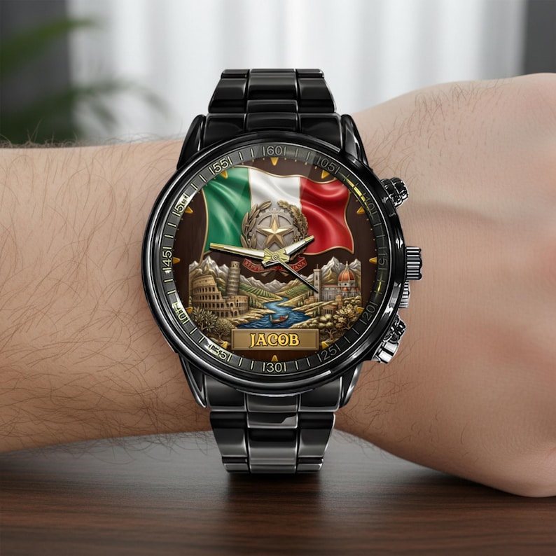 May include: Black wristwatch with a detailed face featuring the Italian flag, a star, and landmarks. The watch has a black metal band and a personalized nameplate that reads "JACOB".
