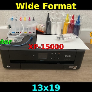 May include: A black Epson XP-15000 DTF printer with ink bottles and cartridges. The image includes the text "Wide Format", "DTF Printer", "Chip Free", "XP-15000", and "13x19".