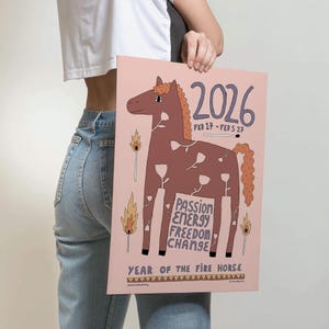 Fire horse art print held by lady in jeans