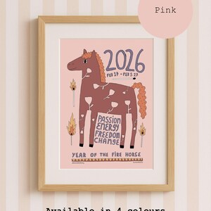A framed art print on a pink background featuring a brown horse illustration with white flower outlines. Text includes 2026, FEB 17 - FEB 5 27, PASSION ENERGY FREEDOM CHANGE, and YEAR OF THE FIRE HORSE. Matches are depicted with flames on the sides.