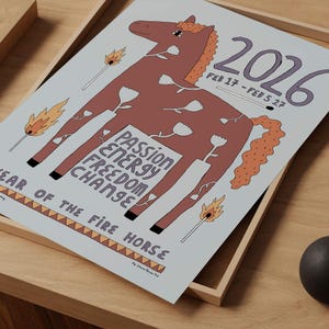 May include: A light blue poster featuring a brown horse illustration with white flower outlines, lit matches, and the text 2026, FEB 17 - FEB 5 27, PASSION ENERGY FREEDOM CHANGE, and YEAR OF THE FIRE HORSE. The design includes a geometric border pattern.