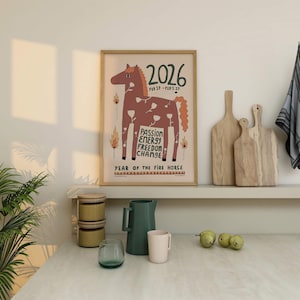 May include: A framed wall art print featuring a brown horse illustration with white flower patterns, flames, and the text 2026, FEB 17 - FEB 5 27, PASSION ENERGY FREEDOM CHANGE, and YEAR OF THE FIRE HORSE on a light beige background.