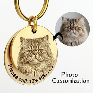 May include: Gold-colored pet tag with a detailed engraved image of a cat's face. The tag includes the text "Please call: 123-456-7890". A smaller image of the cat is shown next to the tag. The words "Photo Customization" are also present.
