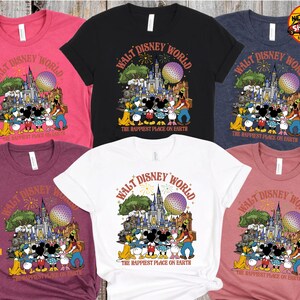 May include: A collection of t-shirts in various colors, each featuring a graphic of Disney characters and the text "Walt Disney World" and "The Happiest Place on Earth". The design includes a castle, Spaceship Earth, and fireworks.