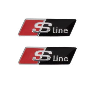 Può includere: Due emblemi S line. Ogni emblema presenta una sezione rossa e argento a sinistra, con un design a "S" argentato. Il lato destro è nero, con la parola "line" in bianco.