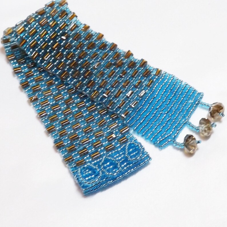 Hand bead woven Blue and Bronze bracelet, silver lined aqua seed beads and bronze lined aqua square beads, Swarovski crystal closure image 1